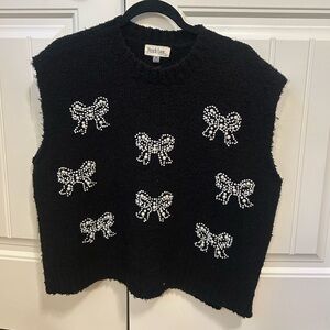 Peach Love California Black Sleeveless Top with White Bow Accents